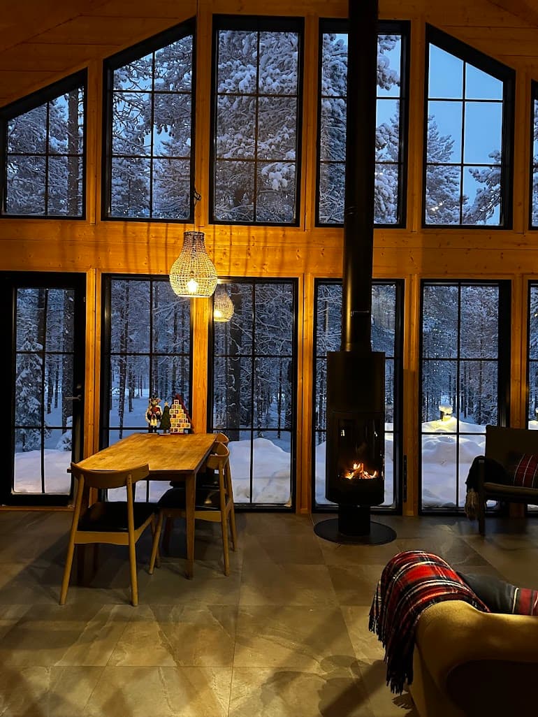 Interior of Snow & Pine at dusk, looking onto the Levi forest